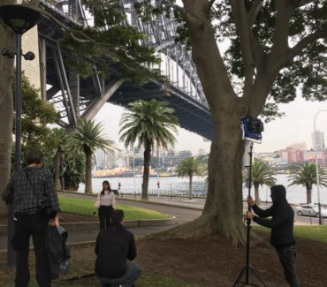 film crew with Sydney Harbour Bridge in background